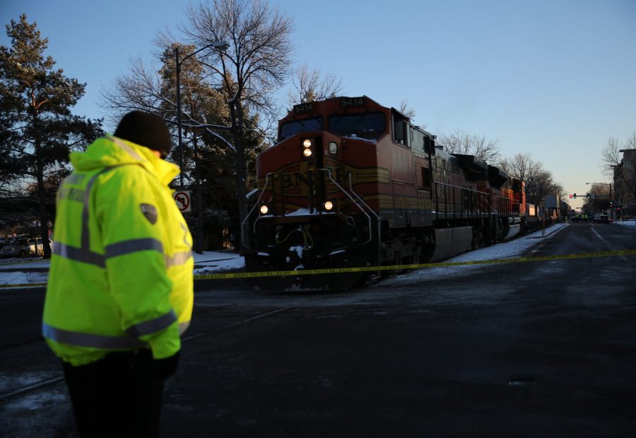 A freight train is stopped near the intersection of Mason and Mulberry streets following a collision with a pedestrian at approximately 2:57 p.m. Feb. 7. One fatality was confirmed by Fort Collins Police Services. (Forrest Czarnecki | Collegian)