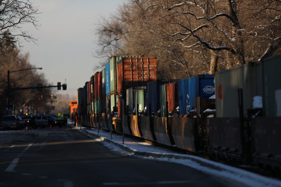 A freight train is stopped near the intersection of Mason and Mulberry streets following a collision with a pedestrian at 2:57 p.m. Feb. 7. One fatality was confirmed by Fort Collins Police Services. (Forrest Czarnecki | Collegian)