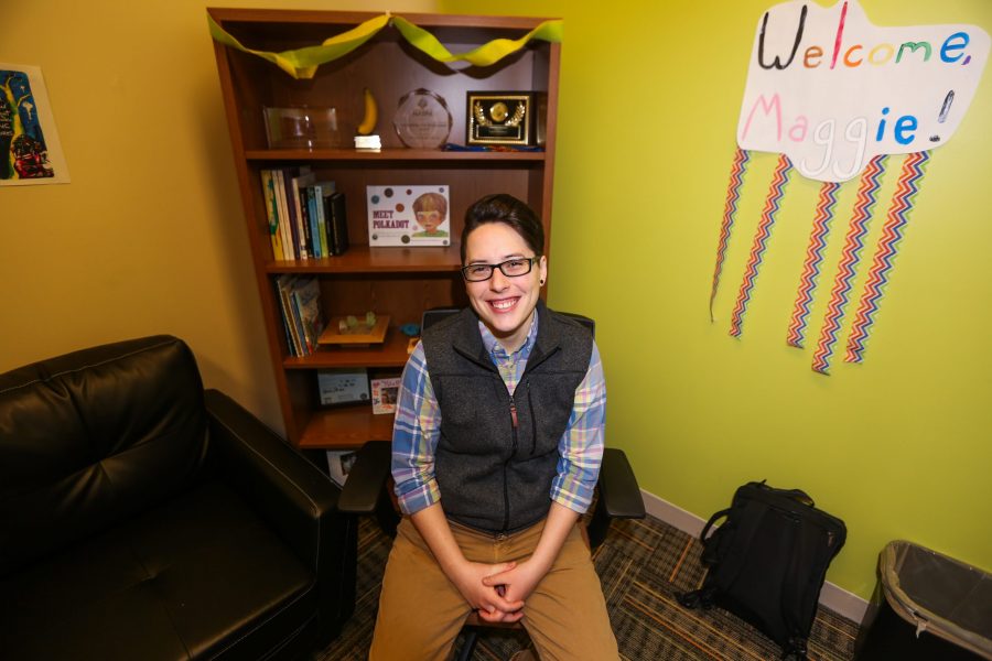 Maggie Hendrickson, new Assistant Director for the PRIDE Resource Center poses for a photograph in their office. (Tony Villalobos May | Collegian)
