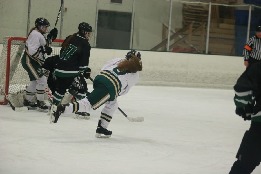 Megan Johnston (8) shoots the puck towards the goal as the CSU take on Utah. Rams win 4-3 (Devin Cornelius | Collegian)
