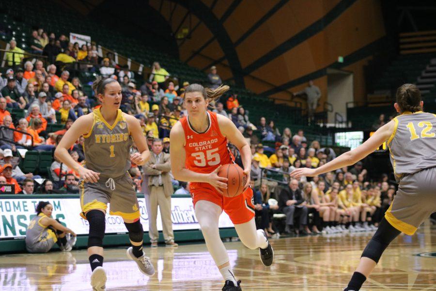 Liah Davis (34) drives toward the basket, during the Border War game. The Rams lose to the Cowgirls 60-49. (Devin Cornelius | Collegian)