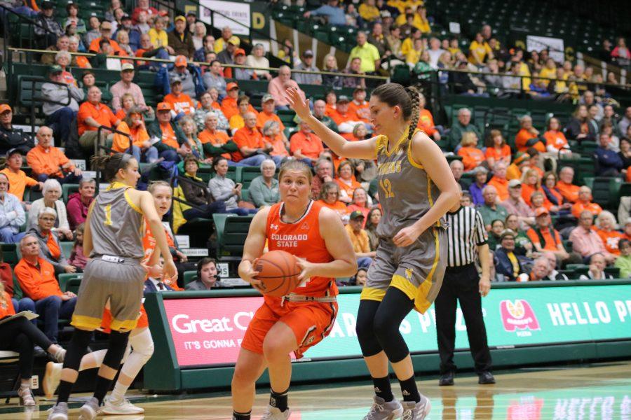 Mollie Mounsey (24) drives in towards the basket, as the Rams battle the Cowgirls. The Rams lose 60-49. (Devin Cornelius | Collegian)