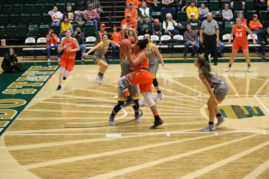 Liah Davis (34) drives in for a layup, during the Border War game. The Rams lose to the Cowgirls 60-49. (Devin Cornelius | Collegian)