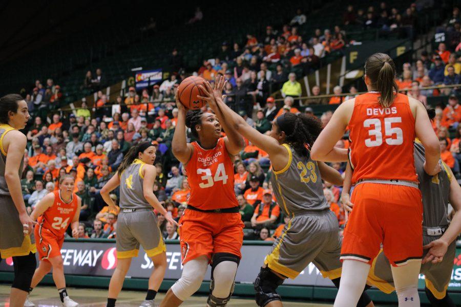 Liah Davis (34) shoots the ball after driving towards the basket, as CSU takes on Wyoming at home. The Rams fall short 60-49. (Devin Cornelius | Collegian)
