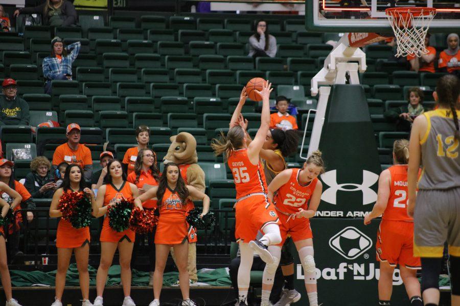 Lore Devos (35) prevents the Cowgirls from rebounding, as CSU takes on Wyoming at home. The Rams fall short 60-49. (Devin Cornelius | Collegian)