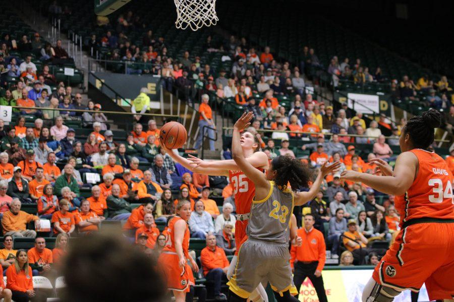 Lore Devos (35) drives under the basket for a layup as the Rams take on the Cowgirls at home. CSU loses 60-49. (Devin Cornelius | Collegian)