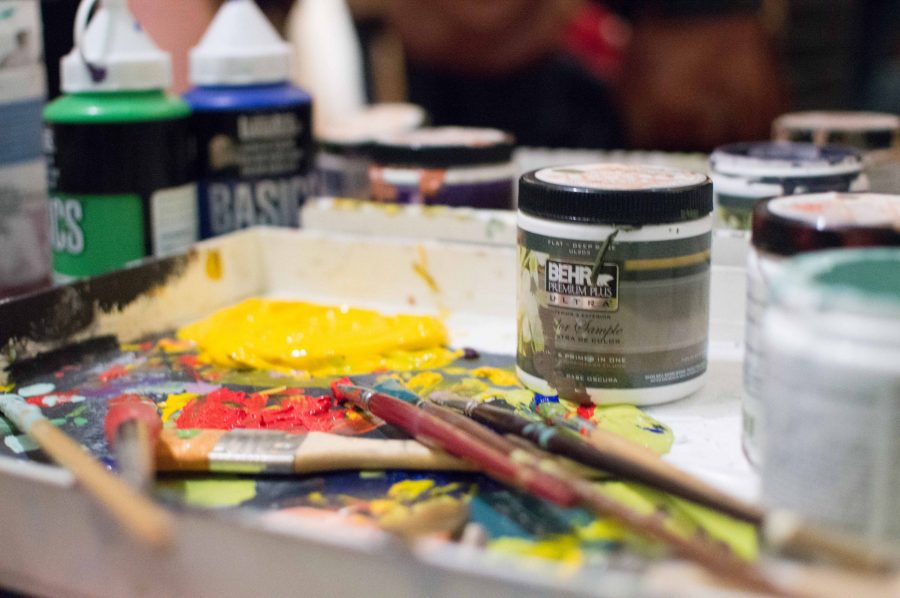 Paints are laid out for attendees to use at the last Art Night at the Downtown Artery Friday, Feb. 15, 2019. (AJ Frankson | Collegian)