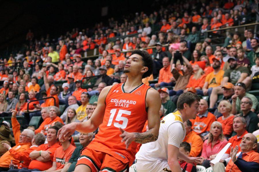 Anthony Masinton-Bonner (15) watches his shot after shooting from the three point line during the game against WYO. CSU wins 83-48. (Devin Cornelius | Collegian)