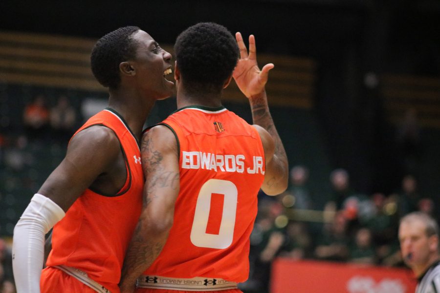Kendle Moore (3) and Hyron Edwards (0) celebrate after Edwards scored, during the Boarder War game. CSU wins 83-48. (Devin Cornelius | Collegian)