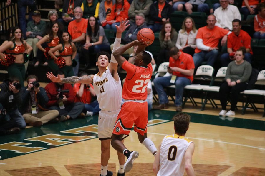 J.D. Paige (22) Shoots a layup, as CSU takes on WYO. The Rams beat the Cowboys 83-48. (Devin Cornelius | Collegian)