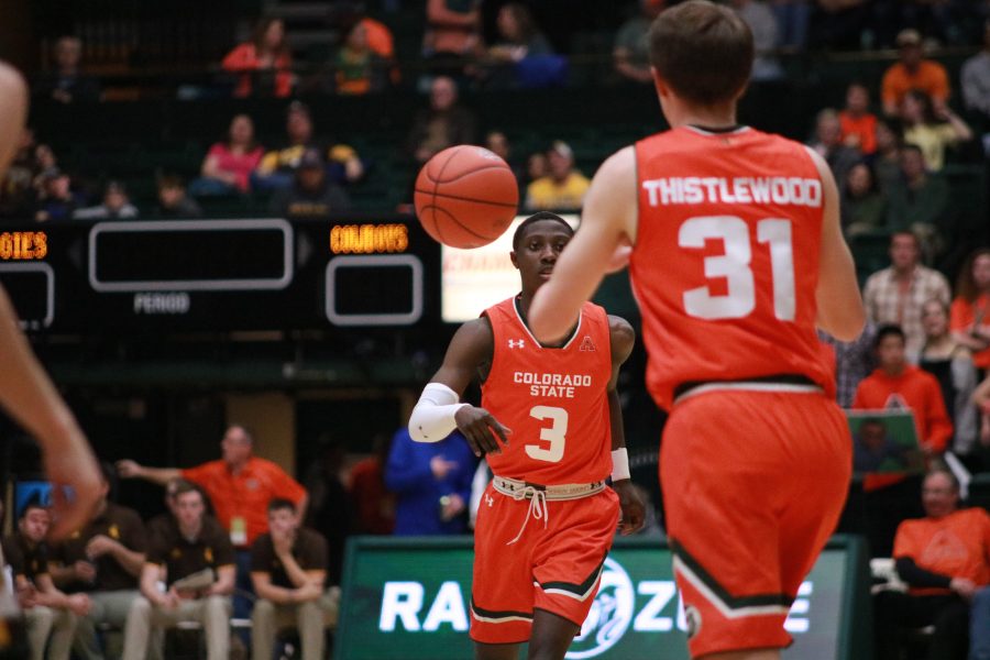 Kendle Moore (3) passes the ball to Adam Thistlewood (31) during the border war game. CSU beats WYO 83-48. (Devin Cornelius | Collegian)