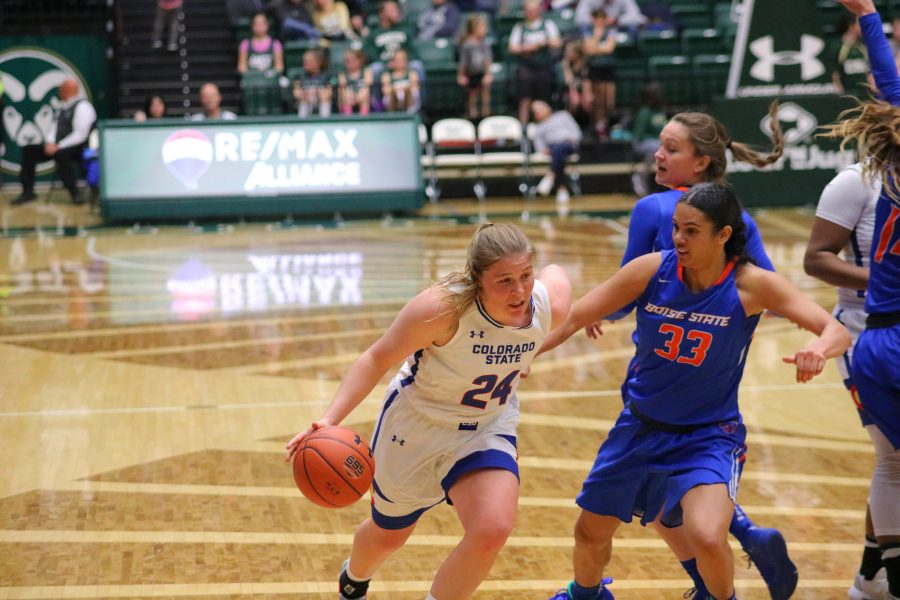 (Mollie Mounsey(24) drives past a defender towards the basket during Colorado State's home basketball game vs Boise State. The Rams fall short in OT 72-63. (Devin Cornelius | Collegian)