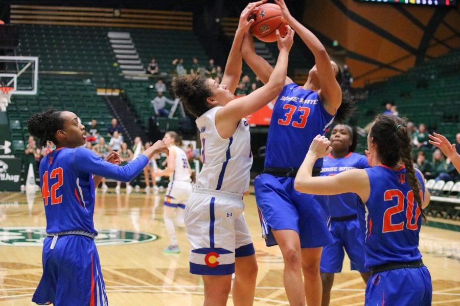 Myanne Hamm(21) fights a defender for possession of a rebound, as Colorado State takes on Boise State at home. The Rams lose in OT 72-63.  (Devin Cornelius | Collegian)