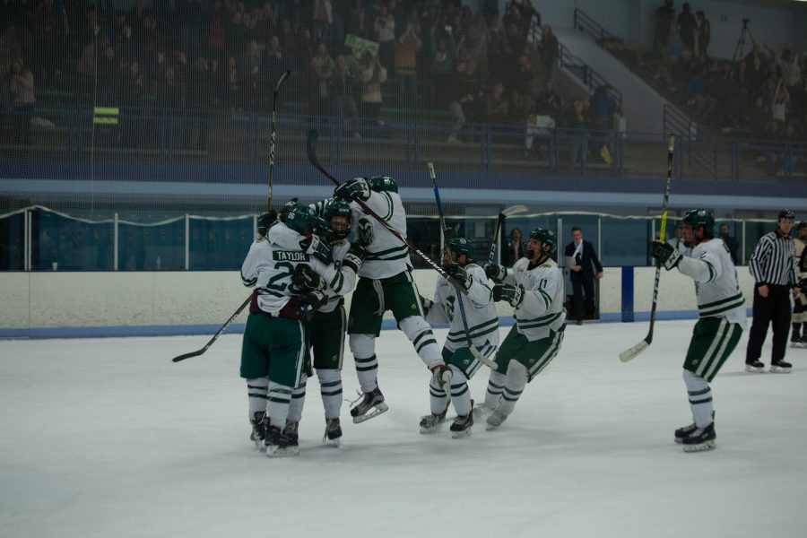The Rams team celebrates their vicotry in the last 5 seconds of overtime. During overtime, the Rams goalie stopped several shots that could have meant the end of the game but he enabled the Rams to play on and win. (Josh Schroeder | Collegian)