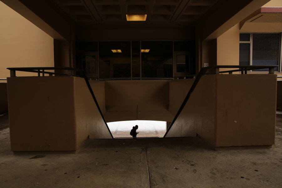 A Colorado State University student walks through the courtyard underneath the Clark B wing while it snows on Feb. 6. Several inches of snow fell on Fort Collins Wednesday morning. No more snow is in the forecast for the rest of the week, although temperatures may stay below 40 degrees Fahrenheit for the next few days, according to the National Weather Service. (Forrest Czarnecki | Collegian)