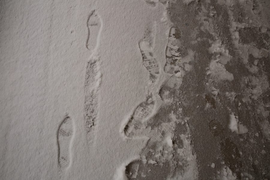 Footprints are pictured in the snow underneath the Clark B wing on Feb. 6. Several inches of snow fell on Fort Collins Wednesday morning. No more snow is in the forecast for the rest of the week, although temperatures may stay below 40 degrees Fahrenheit for the next few days, according to the National Weather Service. (Forrest Czarnecki | Collegian)