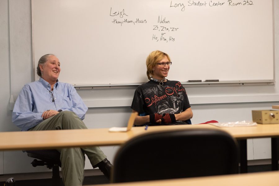 Leigh Redeker and Nathan Klein speak to a student audience during a Visible Voices panel hosted by the Pride Resource Center on campus. Redeker and Klein are both volunteers for the program that intends to increase conversation and knowledge about the LGBTQ community. Redeker says, "[We're here] so we can talk to people and they can get a more personal idea of who we are. We're here to give insights." (Brooke Buchan | Collegian).