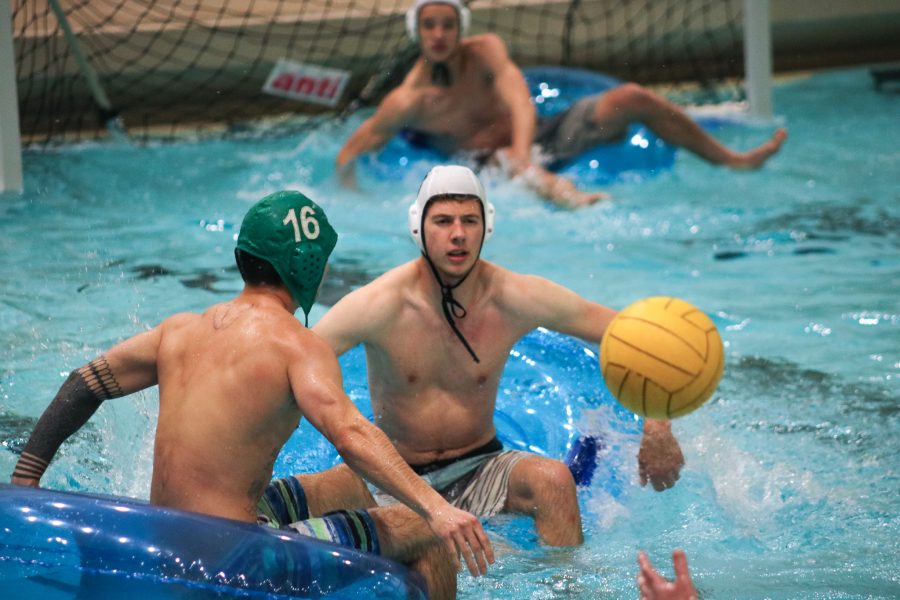 Jay Prather passes the ball to a teammate during an IM inner-tube water polo game. Jay plays for the team Ralph Lauren, which is made up of Students from Mountain View Community Church.  (Devin Cornelius)