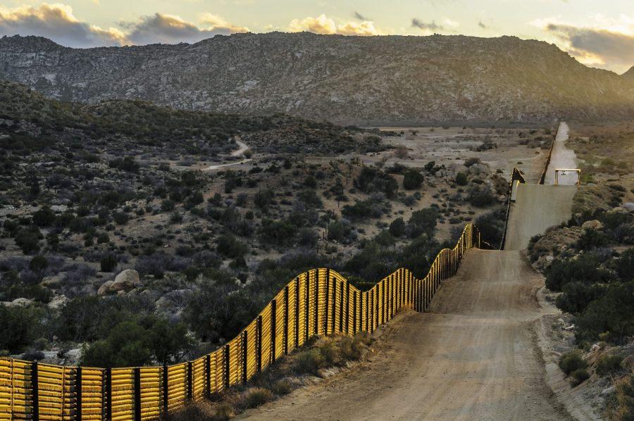 April 7, 2018 - Jacumba, California, U.S. - Image shows US border fence looking southwest on the Mexico border with mountainous terrain.  This type of barrier is generally called 