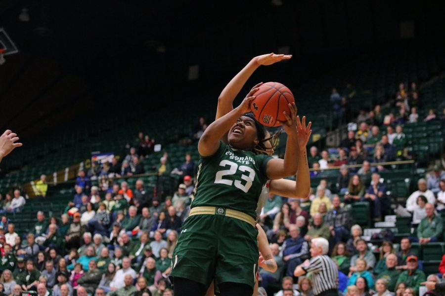 Grace Colaivalu(23) jumps up to shoot a layup while being guarded by a defender, as Colorado State takes on New Mexico at home. CSU falls 79-56. (Devin Cornelius | Collegian)