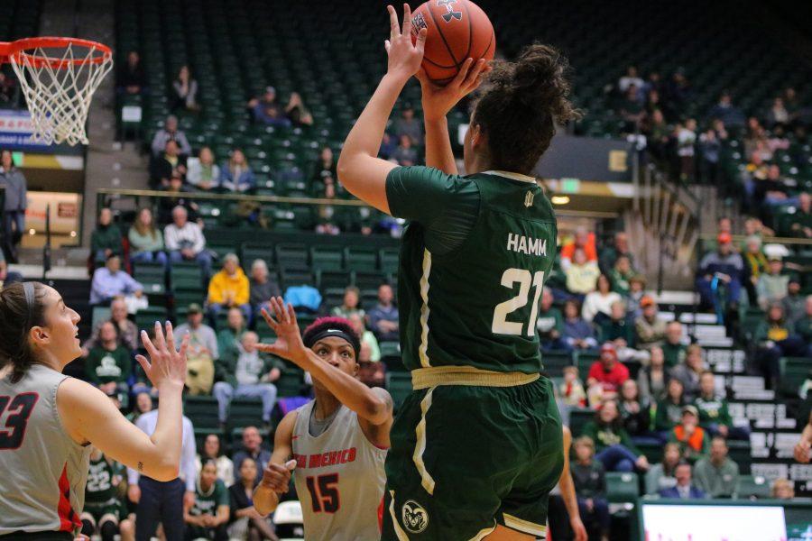 Myanne Hamm(21) jumps and shoots from three, as Colorado State takes on New Mexico at home. The Rams fall 79-56. (Devin Cornelius | Collegian)