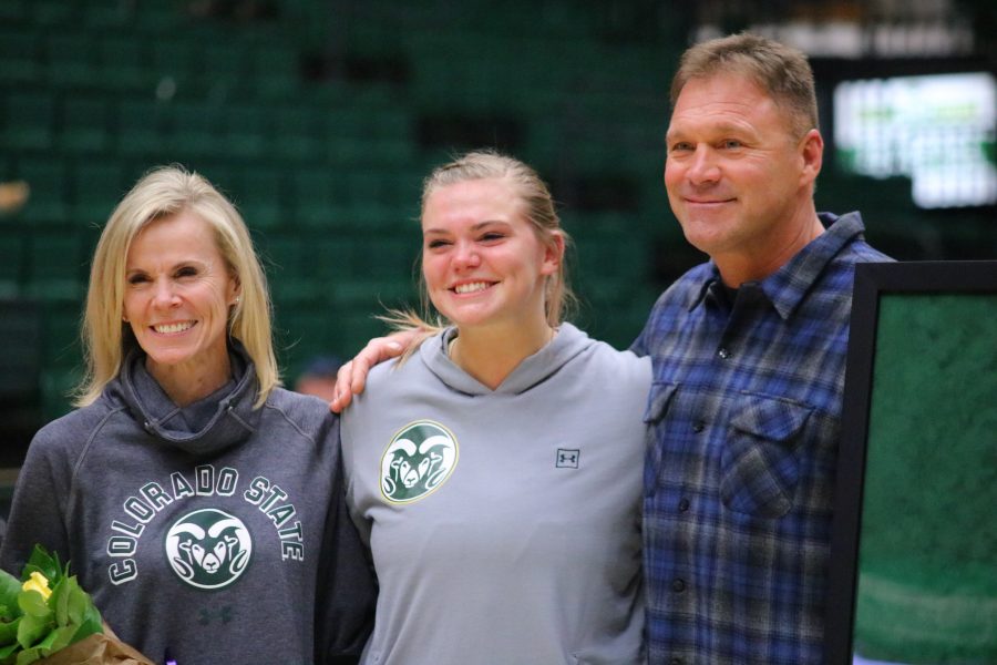 Tatum Neubert (44) smiles with her family, as Colorado State celebrates it's graduating seniors before the last home game of the season. (Devin Cornelius | Collegian)