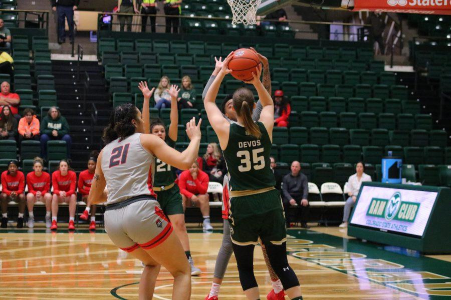 Lore Devos(35) shoots a step back shot from inside the arc, as Colorado State University takes on New Mexico. The Rams fall 79-56. 
(Devin Cornelius | Collegian)