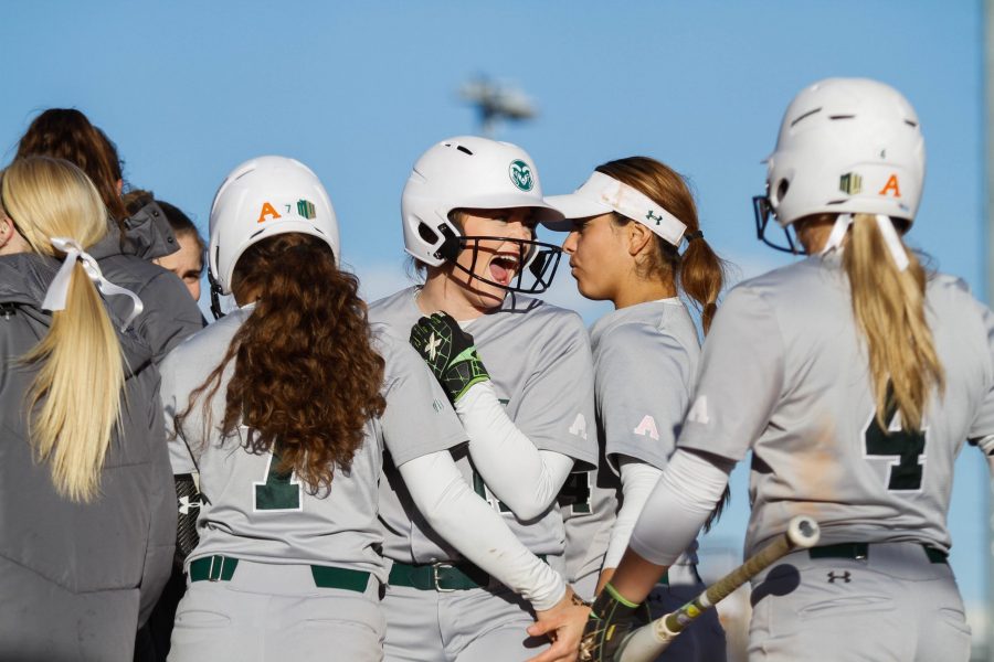 Tara Shadowen is surrounded by her teammates at home plate after scoring a home run during the game against Syracuse March 9. The Rams defeated the Orange 8-6. (Ashley Potts | Collegian)