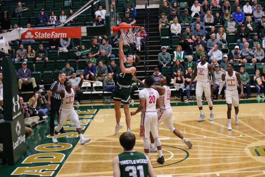 Logan Ryan(21) shoots from underneath the basket while surrounded by defenders, as CSU fights against UNLV. The Rams fall 65-60.  (Devin Cornelius | Collegian)