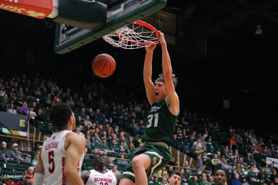 Adam Thistlewood(31) slams the ball through the hoop, as the Rams battle the UNLV Rebels. CSU falls 65-60.(Devin Cornelius | Collegian)
