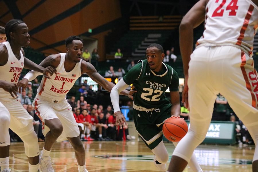 J.D. Paige cuts through the UNLV defenders towards the basket, as CSU battles UNLV at home on senior night. CSU falls short 65-60. (Devin Cornelius | Collegian)