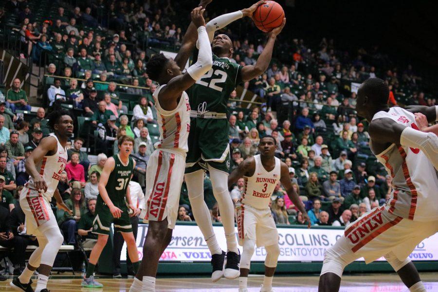 J.D. Paige fights his way up towards the basket while being defended, during CSU's senior day game at home against UNLV. The Rams fall short at the end of regulation 65-60.(Devin Cornelius | Collegian)