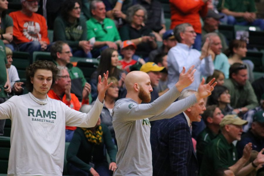 Logan Ryan (21) and Robbie Berwick (14) pump up the crowd during close home game against UNLV. The Rams fall  65-60. (Devin Cornelius | Collegian)