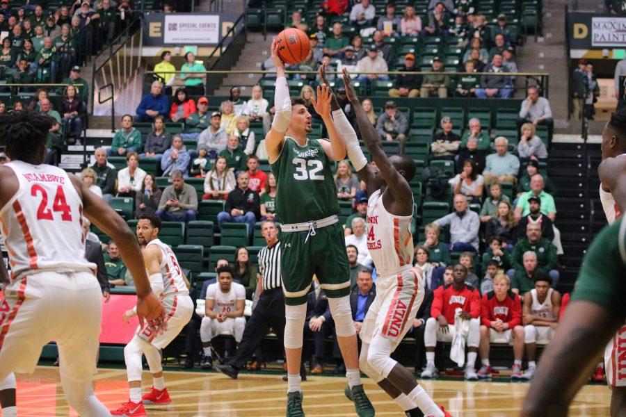 Nico Carvacho (32) spins and shoots over a defender, during CSU's senior day home game against UNLV. The Rams lose 65-60.(Devin Cornelius | Collegian)