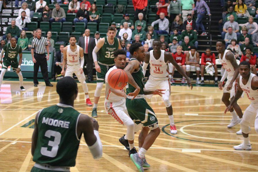 Hyron Edwards (0) passes the ball to Kendle Moore (3) during the CSU senior day game at home vs UNLV. The Rams fall short 65-60. (Devin Cornelius | Collegian)