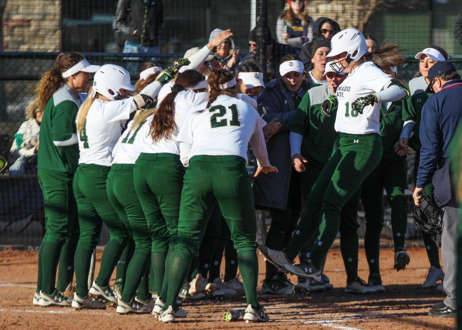 Ashley Michelena crosses home plate to a celebration with her teammates after hitting a home run in the game against Fresno State. (Ashley Potts | Collegian)