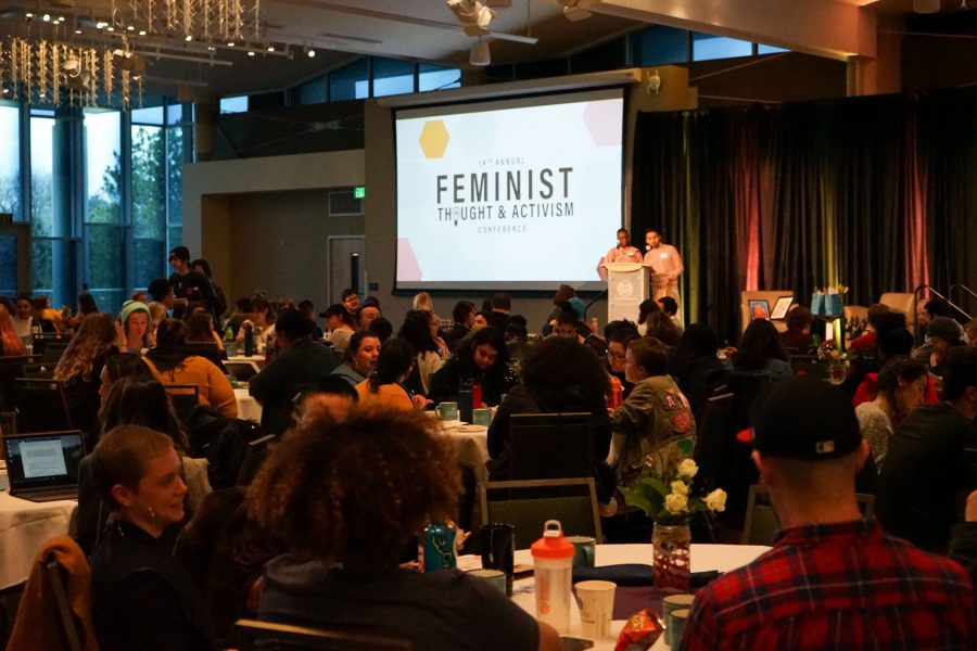 V (left podium) and Jovan (right podium) hosting the raffle during the ending reception of the 14th Annual Feminist Thought and Activism Conference in one of the Lory Student Centers ballrooms. (Skyler Pradhan | Collegian)