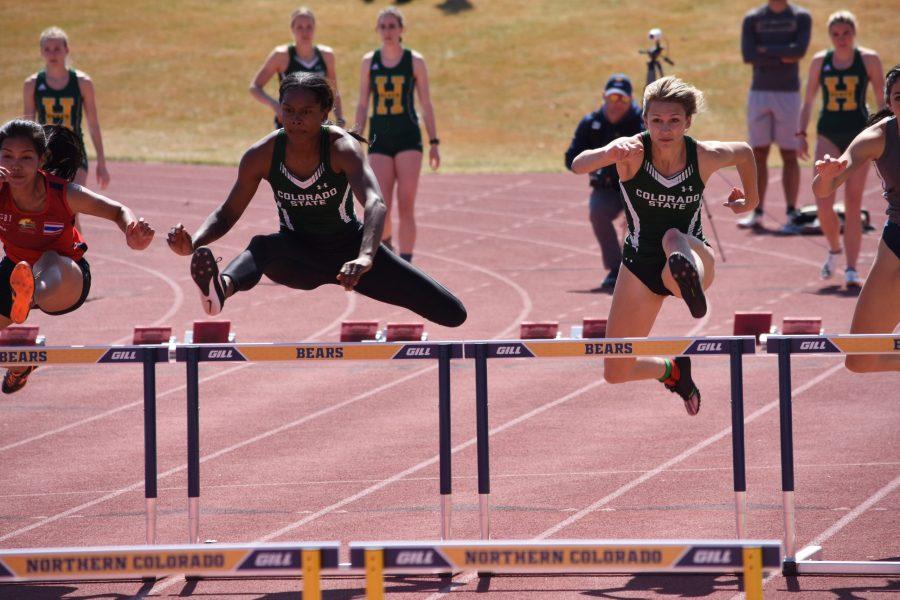 Aria Tate (left) and Amelia Harvey (right) sprint over the first hurdle in the March 31, 2019 race at University of Northern Colorado. Tate would go on to place first and Harvey to place 5th in the event. (Alyse Oxenford | Collegian)