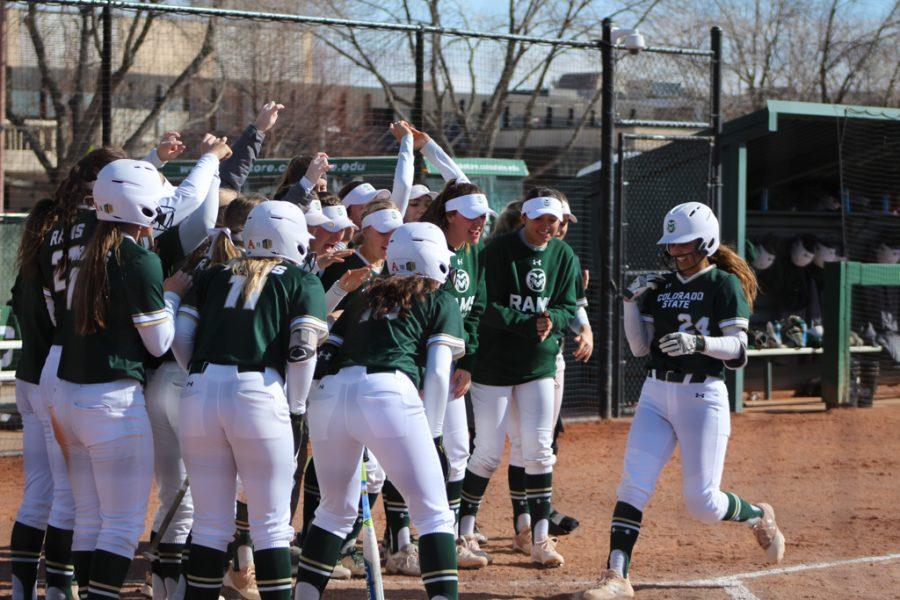 Senior, Isabella Navarro sends a two-run homerun that puts the Rams on the board first. The entire Rams team celebrate the homerun as Navarro trots to the home plate. (Joshua Contreras | Collegian).