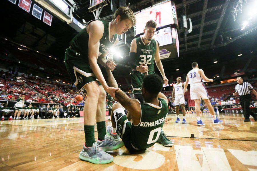  Hyron Edwards is helped up teammates during the first round of the Mountain West Conference Tournament against Boise State on March 13 in Las Vegas, NV. (Tony Villalobos May | Collegian)