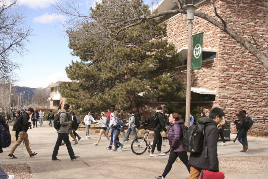 Colorado State University students from across the globe walk outside the Andrew G. Clark Building Mar. 1st. (Alyssa Uhl | Collegian)
