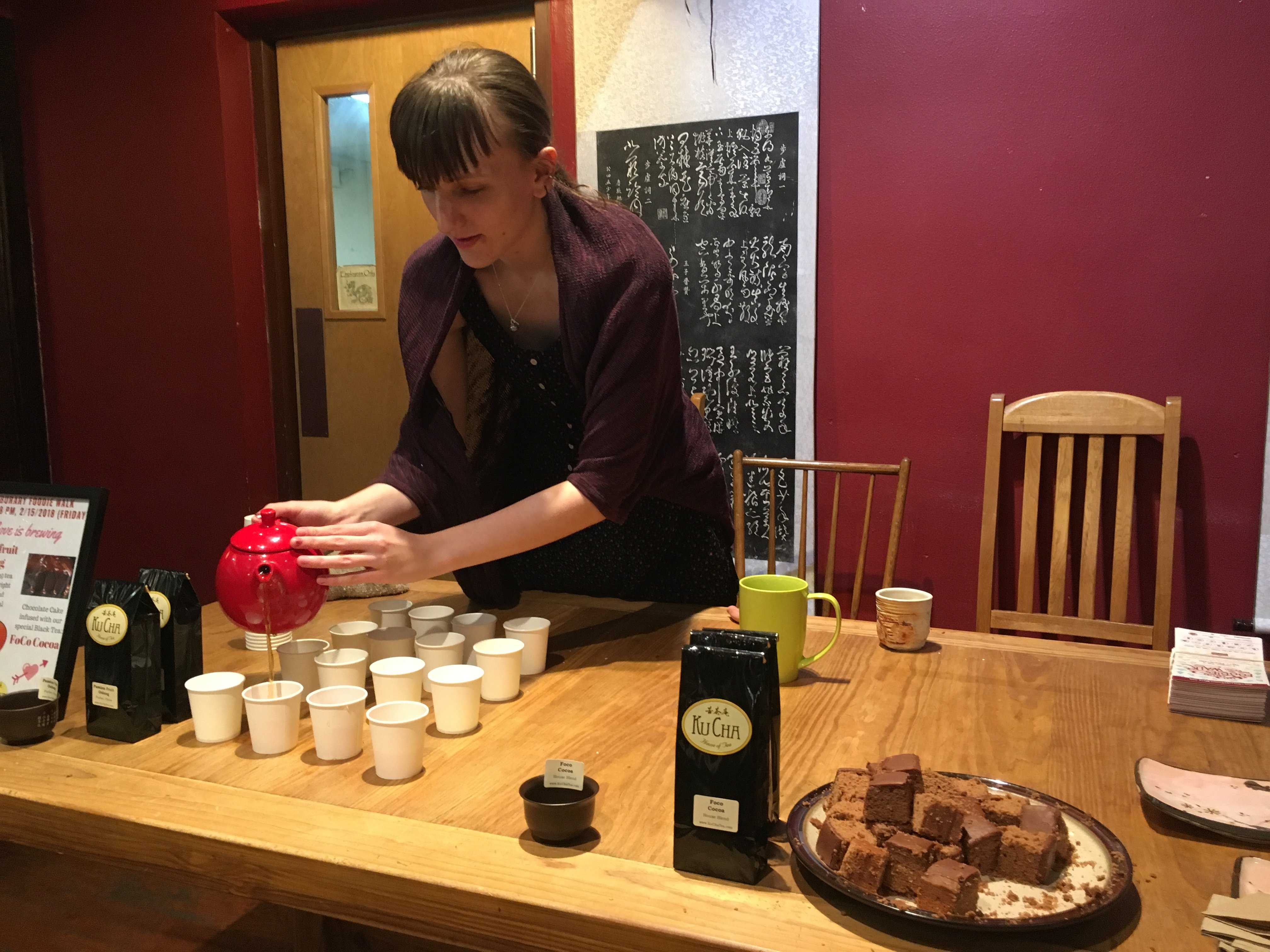 A woman pours tea