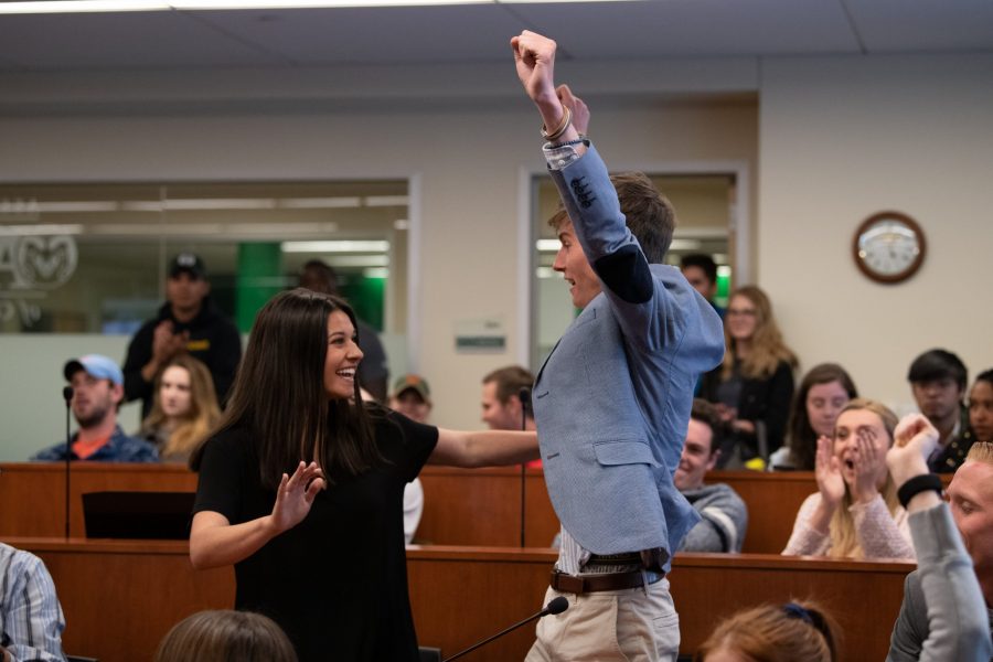 Ben Amundson and Alexandra Farias celebrate after being named the next president and Vice President of the Associated Students of Colorado State University April 11 in the ASCSU Senate Chambers. The election season saw a record-breaking 26.6% voter turnout of the student body. (Colin Shepherd | Collegian)