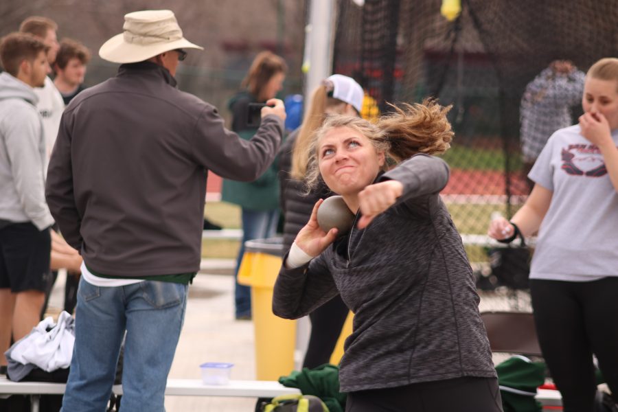 Morgan Stewart throws a shot put ball at the Doug Max Invitational. She placed sixth over all. (Devin Cornelius | Collegian)