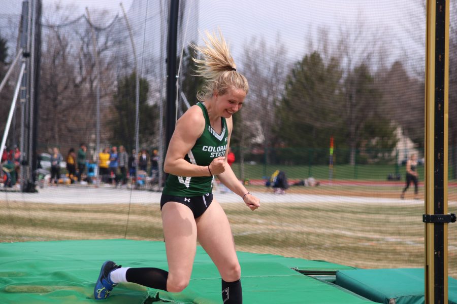 Madeline Wilson celebrates after getting over the bar during the Doug Max Invitational. She reached 3.75 during the meet and finished second overall. (Devin Cornelius | Collegian)