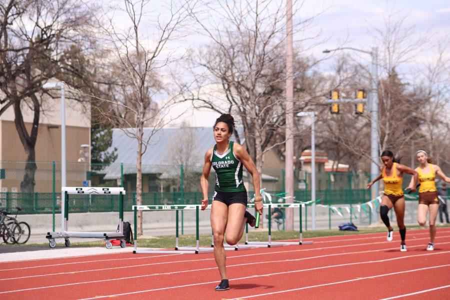 Jessica Ozoude sprints towards the finish line during the 4x100 relay, at the Doug Max Invitational. CSU's relay team finished first in the event. (Devin Cornelius | Collegian)