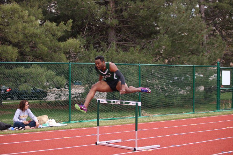 Kamal-Craig Golaube leaps a hurdle during the Doug Max Invitational. Golaube placed third in the event.(Devin Cornelius | Collegian)