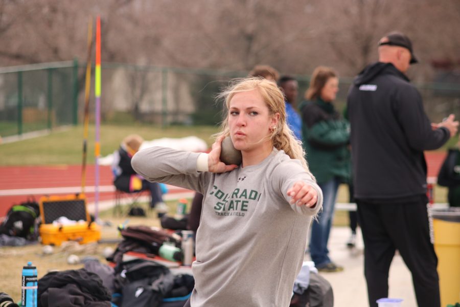 Tarynn Sieg winds up to throw the shot put ball, at the Doug Max invitational. Sieg placed first in the event with a distance of  14.96m. (Devin Cornelius | Collegian)