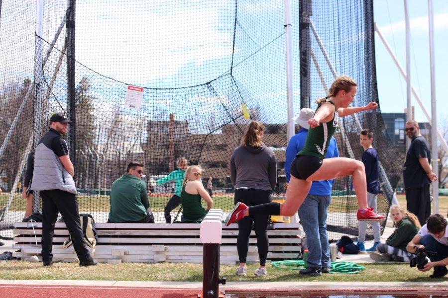 Emma Atwell pushes off of the steeple during the steeple chase event at the Doug Max Invitational. Atwell placed first in the event. (Devin Cornelius | Collegian)