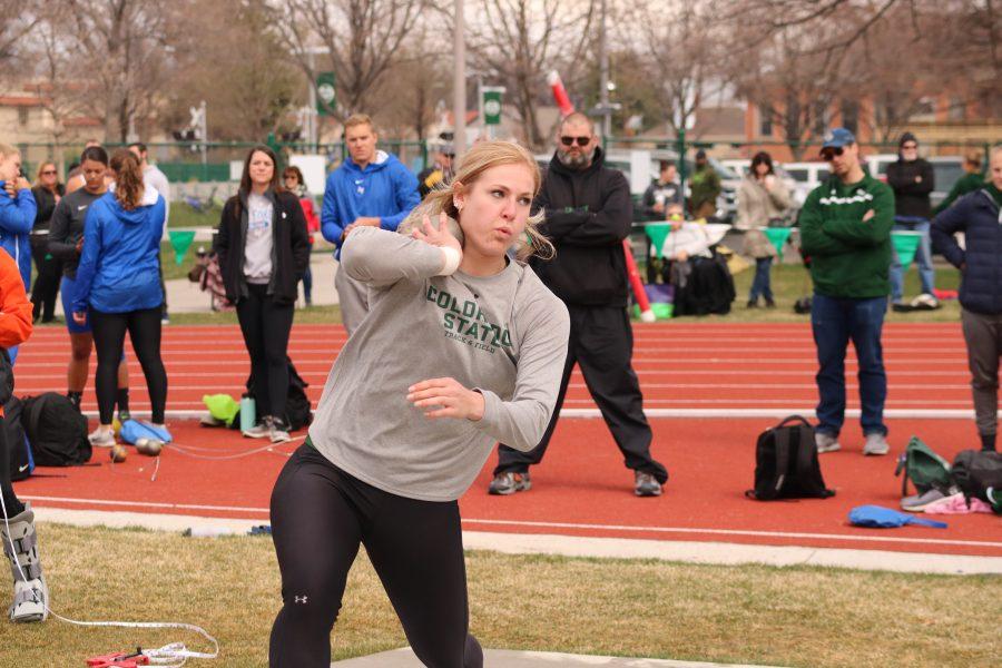 Tarynn Sieg prepares to launch the shot put ball, at the Doug Max invitational. Sieg placed first in the event with a distance of  14.96m. (Devin Cornelius | Collegian)